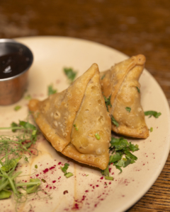 Homemade samosas with salad at The Gate Pub